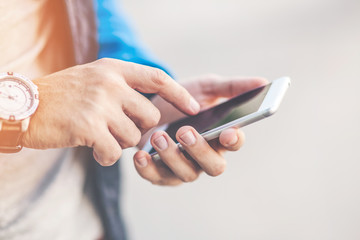 Close up of a Man's hands using mobile smartphone