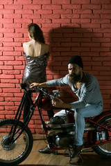Obraz na płótnie Canvas bearded biker man on motorbike