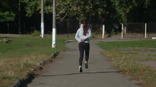 Girl jogging on the street
