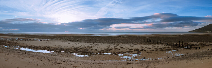 Fototapeta na wymiar panoramic view of sunrise in Newcastle beach,Northern Ireland