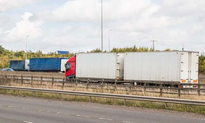 Fototapeta na wymiar Busy british motorway full of lorries