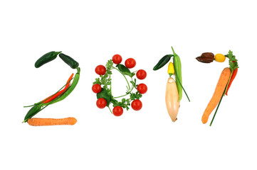 Number 2017 written with vegetables, as a metaphor or concept for healthy food, living, diet, recipe. Isolated on white background happy new year