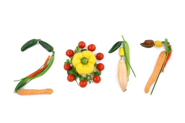 Number 2017 written with vegetables, as a metaphor or concept for healthy food, living, diet, recipe. Isolated on white background happy new year