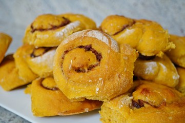Platter of freshly baked vegan pumpkin cinnamon rolls