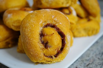 Platter of freshly baked vegan pumpkin cinnamon rolls