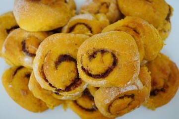 Platter of freshly baked vegan pumpkin cinnamon rolls