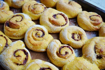 Tray of freshly baked vegan pumpkin cinnamon rolls