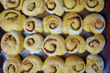 Tray of freshly baked vegan pumpkin cinnamon rolls
