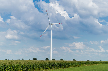 Windmill for electric power production in country side background, Poland