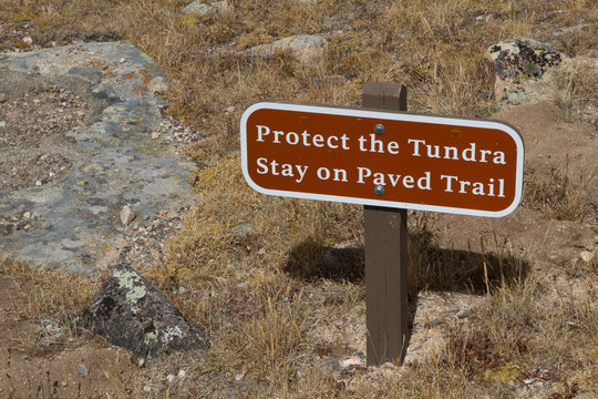 Protect the Tundra Stay on Paved Trail warning sign