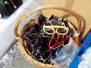 Basket of old-fashioned sunglasses