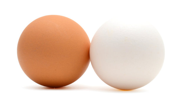 Two white and brown eggs isolated on white background