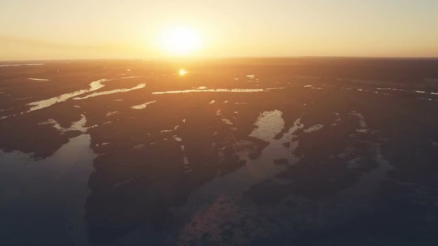 Aerial View: Flight over the Beautiful River in sunset soft light. Magestic landscape. 4K resolution.