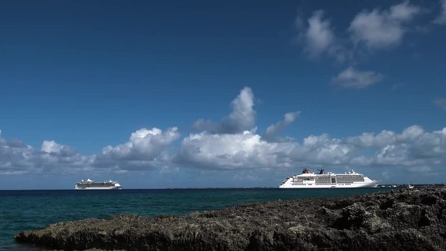 cruise ship moored in the caribbean on tropical seas timelapse