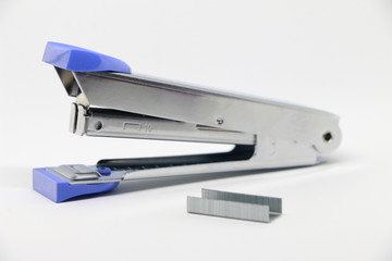 Stapler on the white background. Miscellaneous of office equipment. Paper clip,Stapler