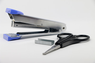 Stapler on the white background. Miscellaneous of office equipment. Paper clip,Stapler