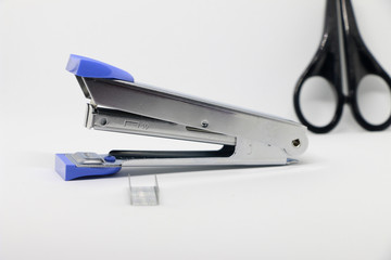 Stapler on the white background. Miscellaneous of office equipment. Paper clip,Stapler