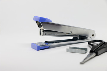 Office tool. Stapler on the white background. Miscellaneous of office equipment. Paper clip,Stapler