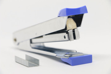 Office tool. Stapler on the white background. Miscellaneous of office equipment. Paper clip,Stapler