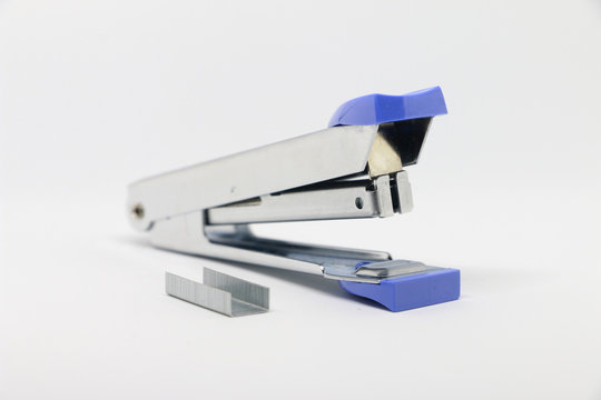 Office tool. Stapler on the white background. Miscellaneous of office equipment. Paper clip,Stapler