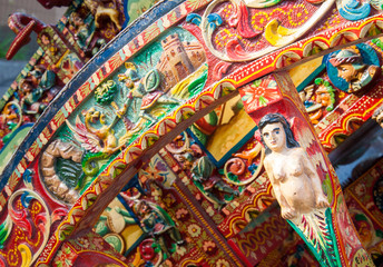 Close-up view of a colorful detail of a typical sicilian cart