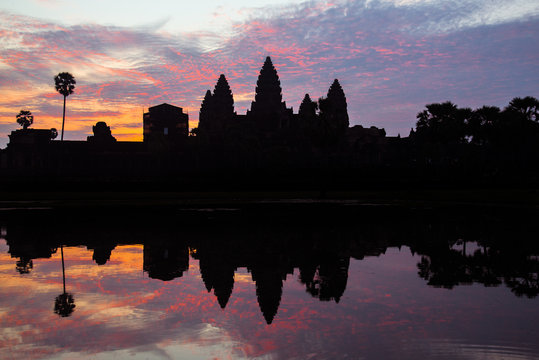 The silhouette of Angkor Wat the largest religious temple in the world before the sunrise in Siem Reap, Cambodia.
