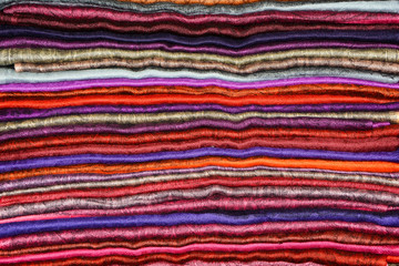 Colored Indian shawls cashmere background 
