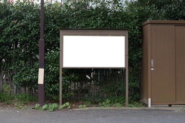 Large blank billboard on a street wall, banners with room to add your own text