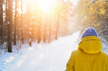 Happy beauty woman walking in the Park in winter.