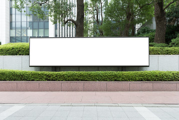 Large blank billboard on a street wall, banners with room to add your own text