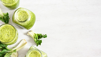 Green vegetable smoothie in jars. Green detox. Healthy food concept.