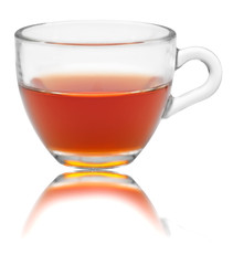 glass cup of tea with own reflection on isolated white backgroun