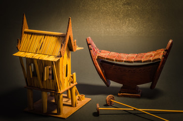 Model home made of bamboo on black background