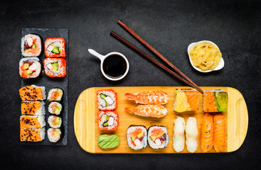 Fototapeta na wymiar Sushi Delicacy with Soy Sauce, Wasabi and Sashimi