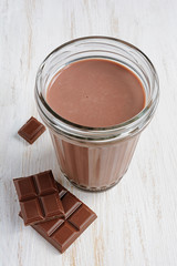 Chocolate milk with pieces of chocolate bar
