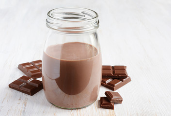 Chocolate milk with pieces of chocolate bar