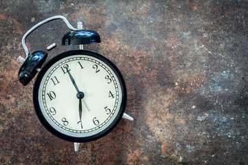 Alarm clock on  stone background