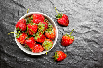 Fresh strawberries on black background