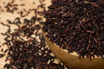 Rice Berry,Thai Jasmine rice on wood cup,Close-up shot.