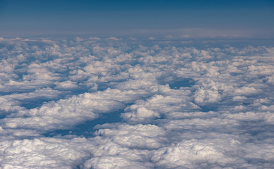 Fototapeta na wymiar View from airplane at clouds.