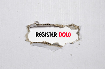 The word register now appearing behind torn paper