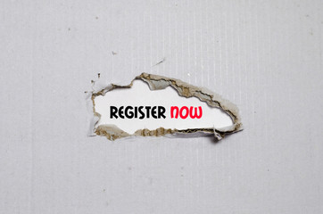The word register now appearing behind torn paper