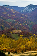 Fototapeta na wymiar Rolling hills and mountains at autumn sunny day, view from Bobija mountain, Serbia