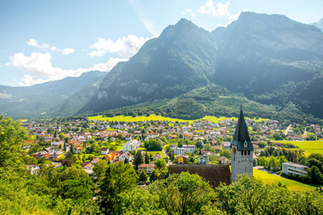 Landscape view on Balzers village with saint Nicholas church in Liechtenstein - obrazy, fototapety, plakaty