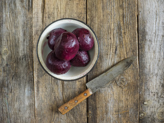 boiled beets in enameled metal bowl