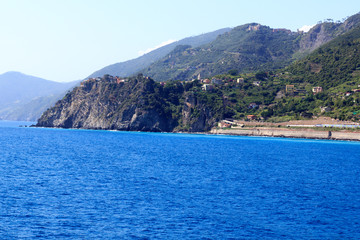 Fototapeta na wymiar Rocky coast and Cinque Terre village Corniglia and Mediterranean Sea, Italy