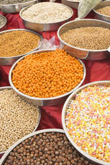 A variety of nuts in the glaze: peanuts, hazelnuts, chestnuts, walnuts, pistachio and pecans. Food and cuisine. (Selective focus)