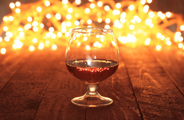 photo cognac glass in front of bokeh background © v_l