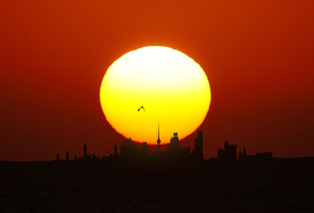 Kuwait City landscape view during beautiful golden sunset on summer time - 124493886