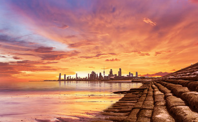 Naklejka na ściany i meble Kuwait City landscape view during beautiful golden sunset on summer time